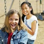 Children playing on swings